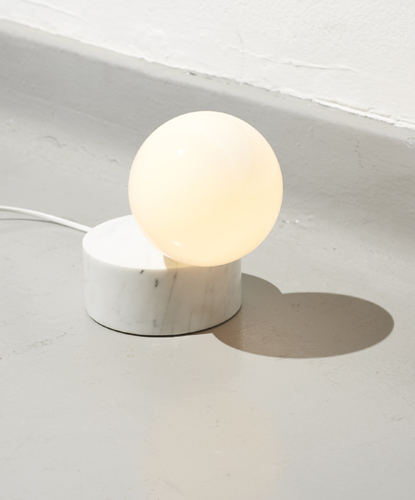 Litho light by Vormen, spherical stone sculpture on terrazzo pedestal