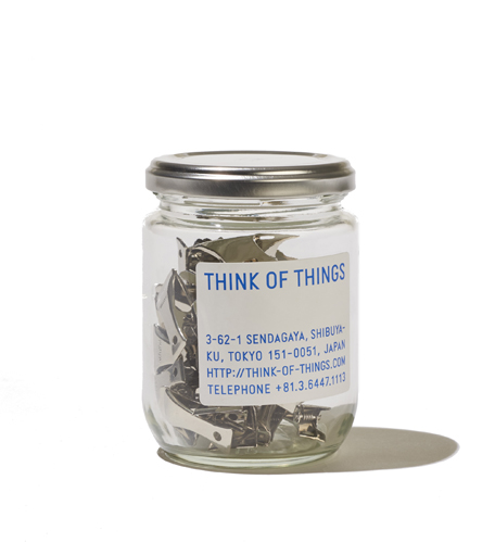 Glass jar filled with metal clips by Think of Things.