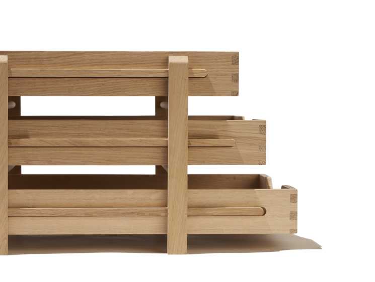 Three-tiered oak file tray with sliding levels by Present & Correct.