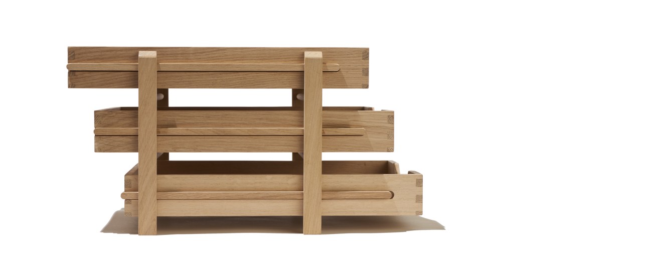 Three-tiered oak file tray with sliding levels by Present & Correct.