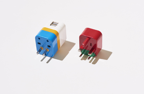 Flight 001 universal travel adaptor in blue and red with multiple outlet configurations.