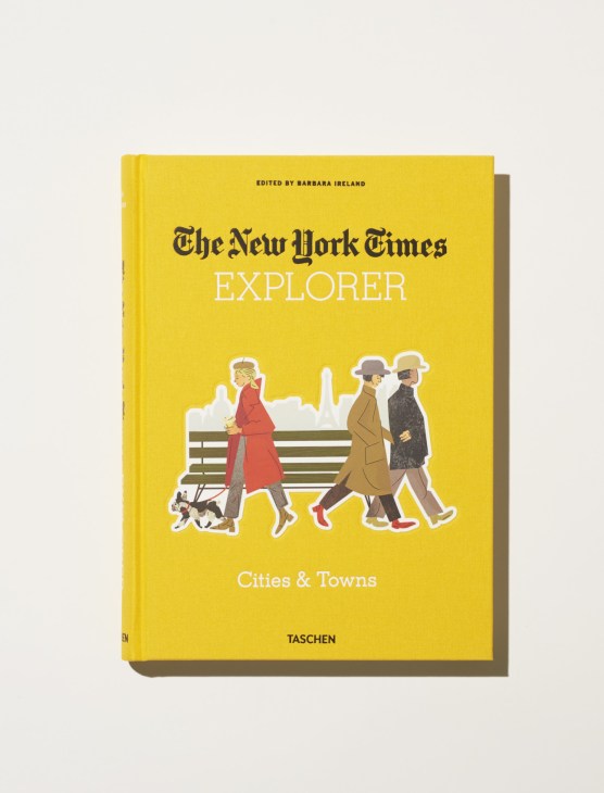 The New York Times Explorer: Cities & Towns book cover edited by Barbara Ireland, published by Taschen, featuring illustrated figures on a yellow background.