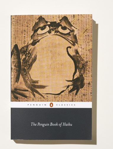 The Penguin Book of Haiku with traditional Japanese artwork featuring birds on cork-textured cover.