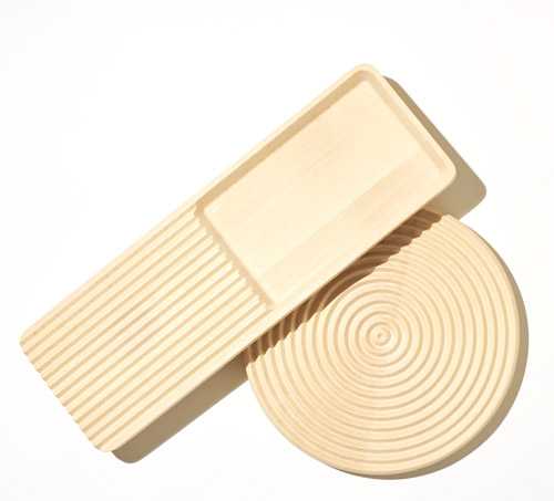 Wooden trivet and serving board by Case Furniture with oil-treated beech surface.