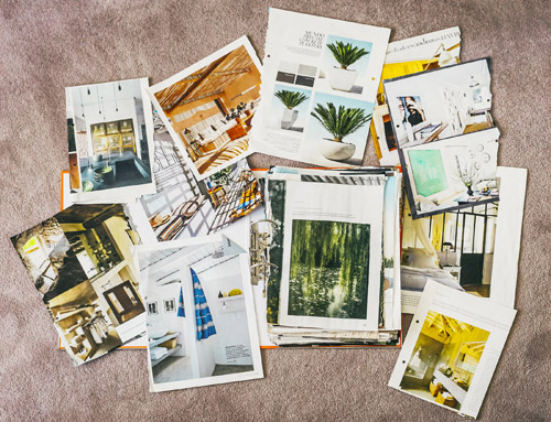 Collection of scrapbooks and inspiration materials including architectural photos and design clippings.