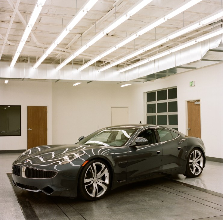 Fisker Karma plug-in electric hybrid sports car in a white studio space
