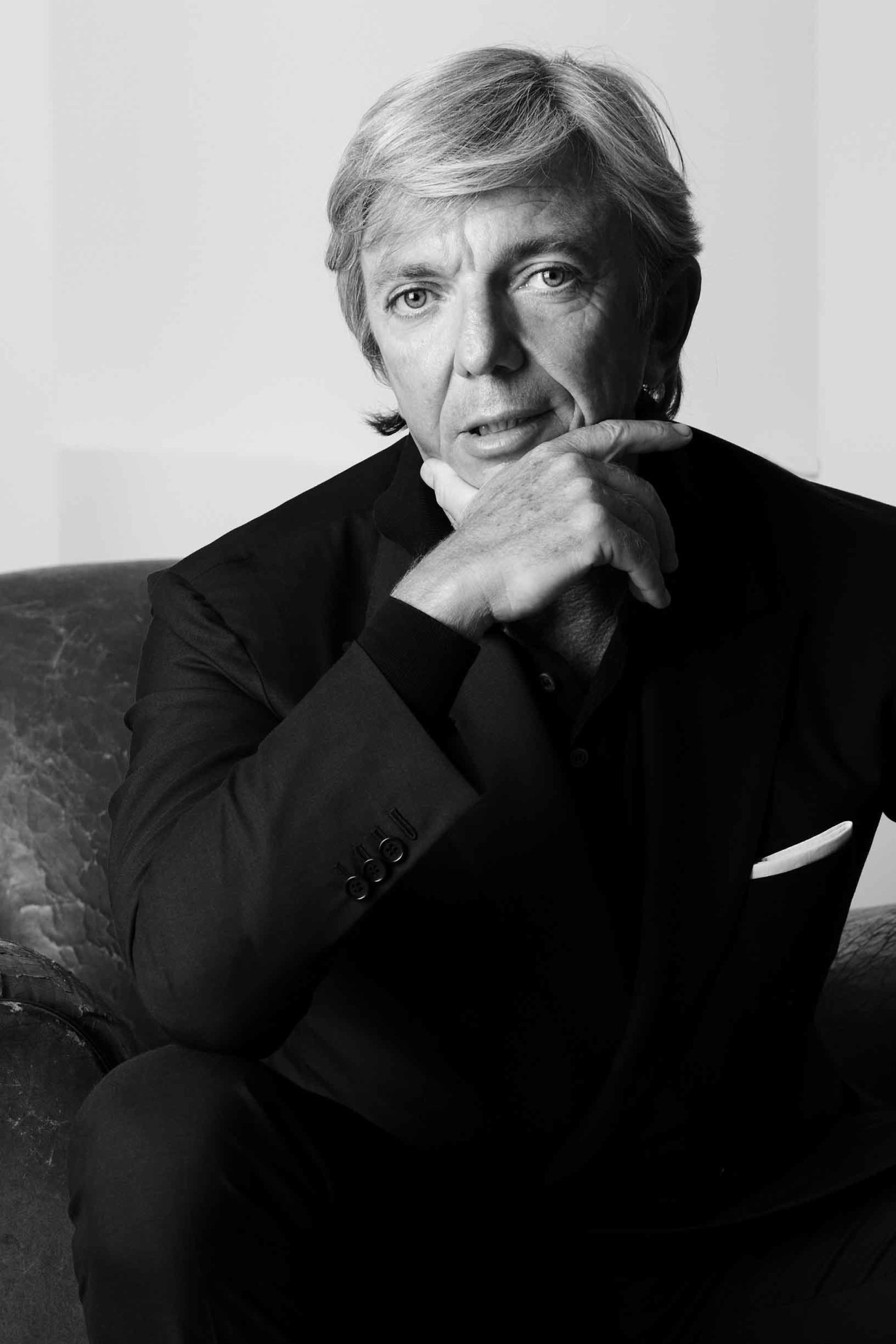 Black and white portrait of Mario Giarotto, CEO of Slowear, in a contemplative pose.