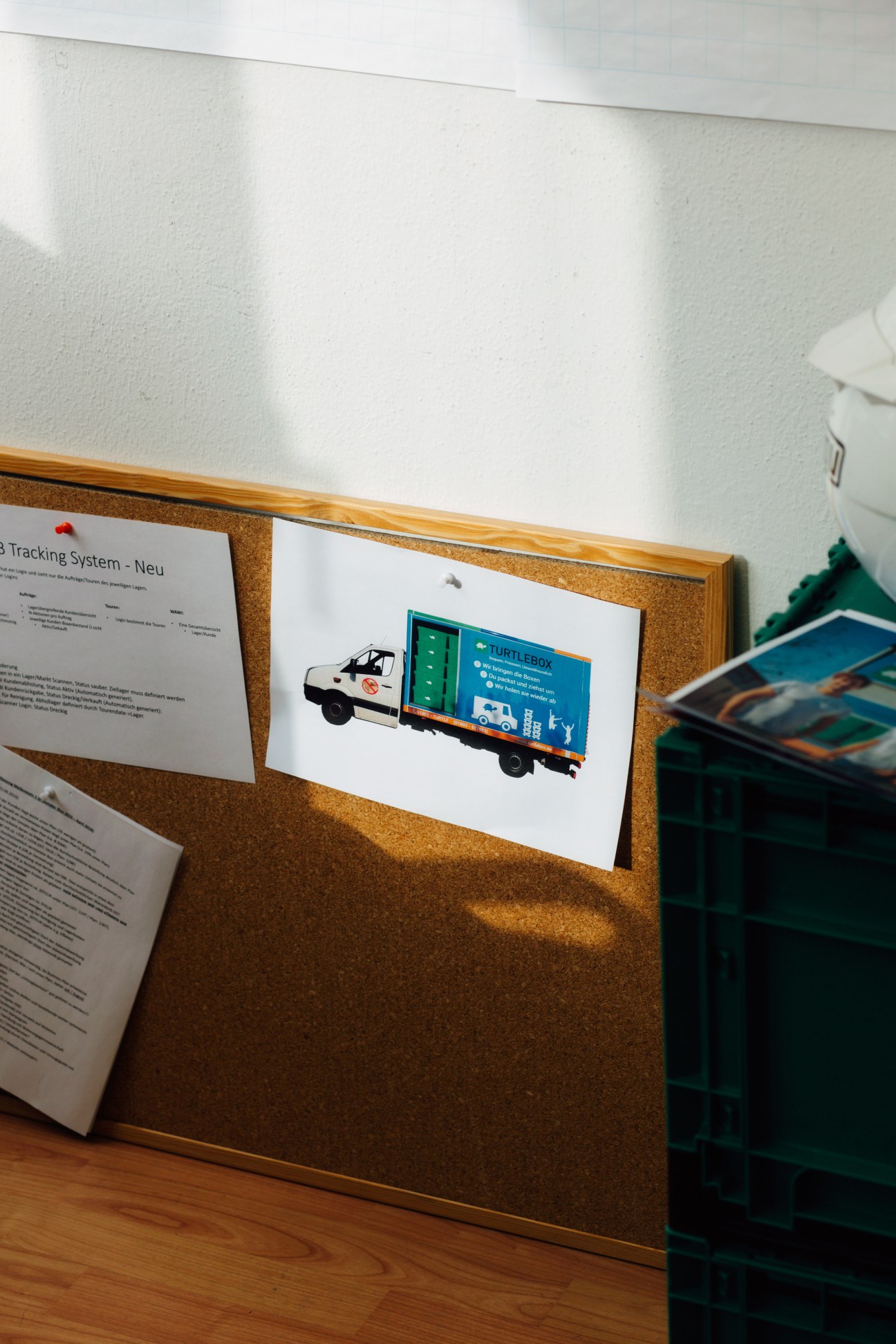 Illustration of the TurtleTruck delivery vehicle pinned to a cork board in an office.