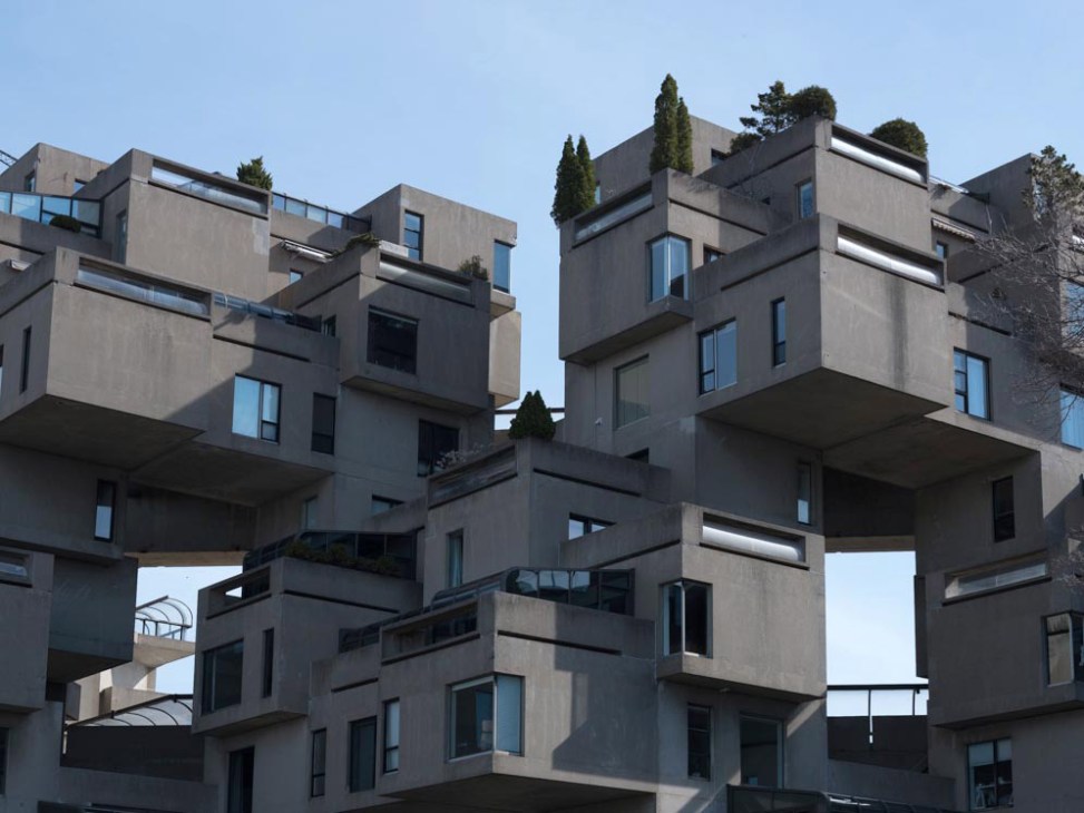 Habitat 67, a brutalist concrete residential complex with stacked modular cubic units and rooftop vegetation.