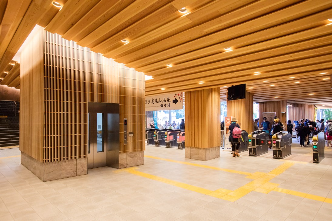 Takaosanguchi Station interior with dramatic wooden ceiling and cedar roof designed by architect Kengo Kuma.