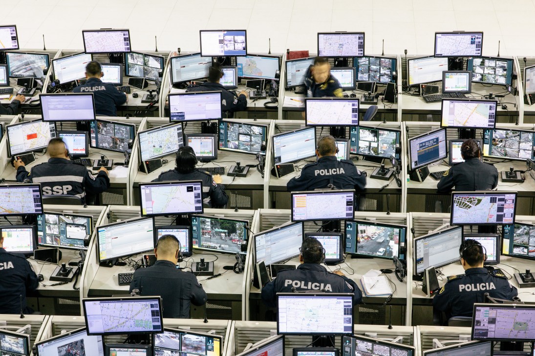 Police officers monitor surveillance screens at the C4 monitoring centre in Mexico City.