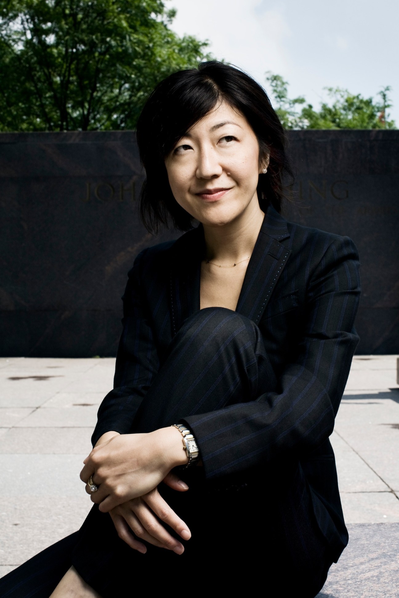 Aya Igarashi, Washington correspondent for The Yomiuri Shimbun, poses outdoors in professional attire.