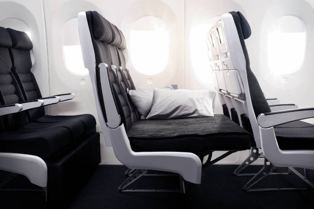 Air New Zealand Skycouch economy seating with convertible lie-flat bed configuration for couples.
