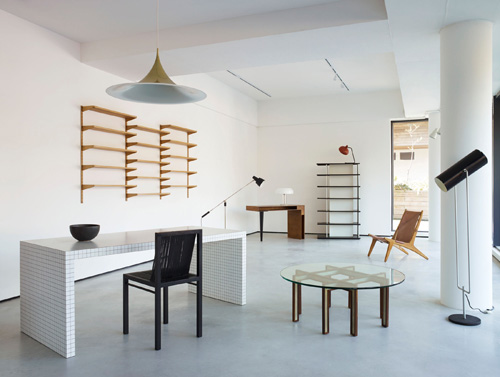 Interior of Béton Brut furniture showroom with mid-century modern pieces and minimalist décor.