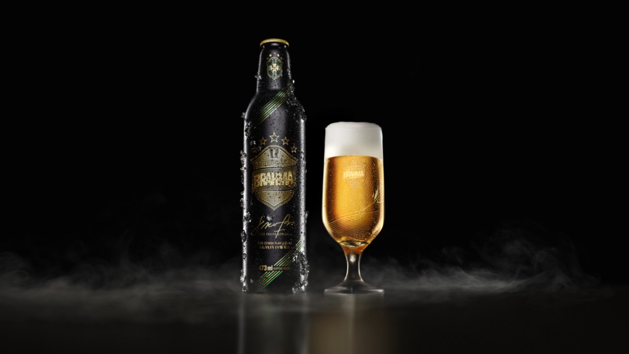 Brahma Seleção Especial beer bottle and glass on black surface with condensation