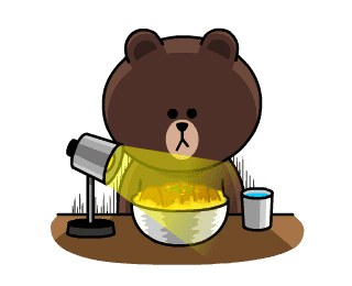 Brown, a cartoon bear character wearing a yellow shirt, holding cooking utensils in a kitchen setting.