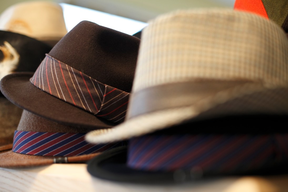 Display of men's hats with striped bands at Chapterfour boutique in Portland.