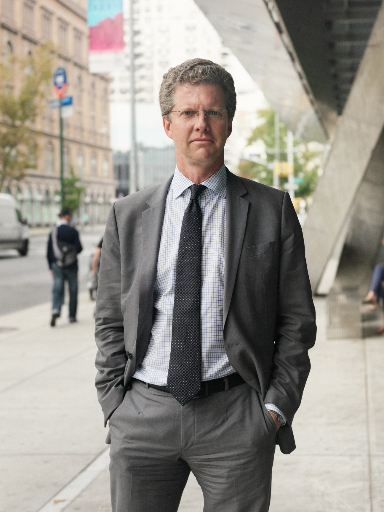 Shaun Donovan, US Housing and Urban Development secretary, standing on an urban street.
