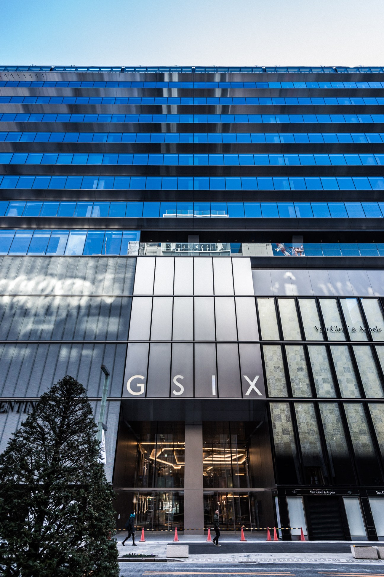 Ginza Six luxury shopping development exterior with blue glass facade in Tokyo