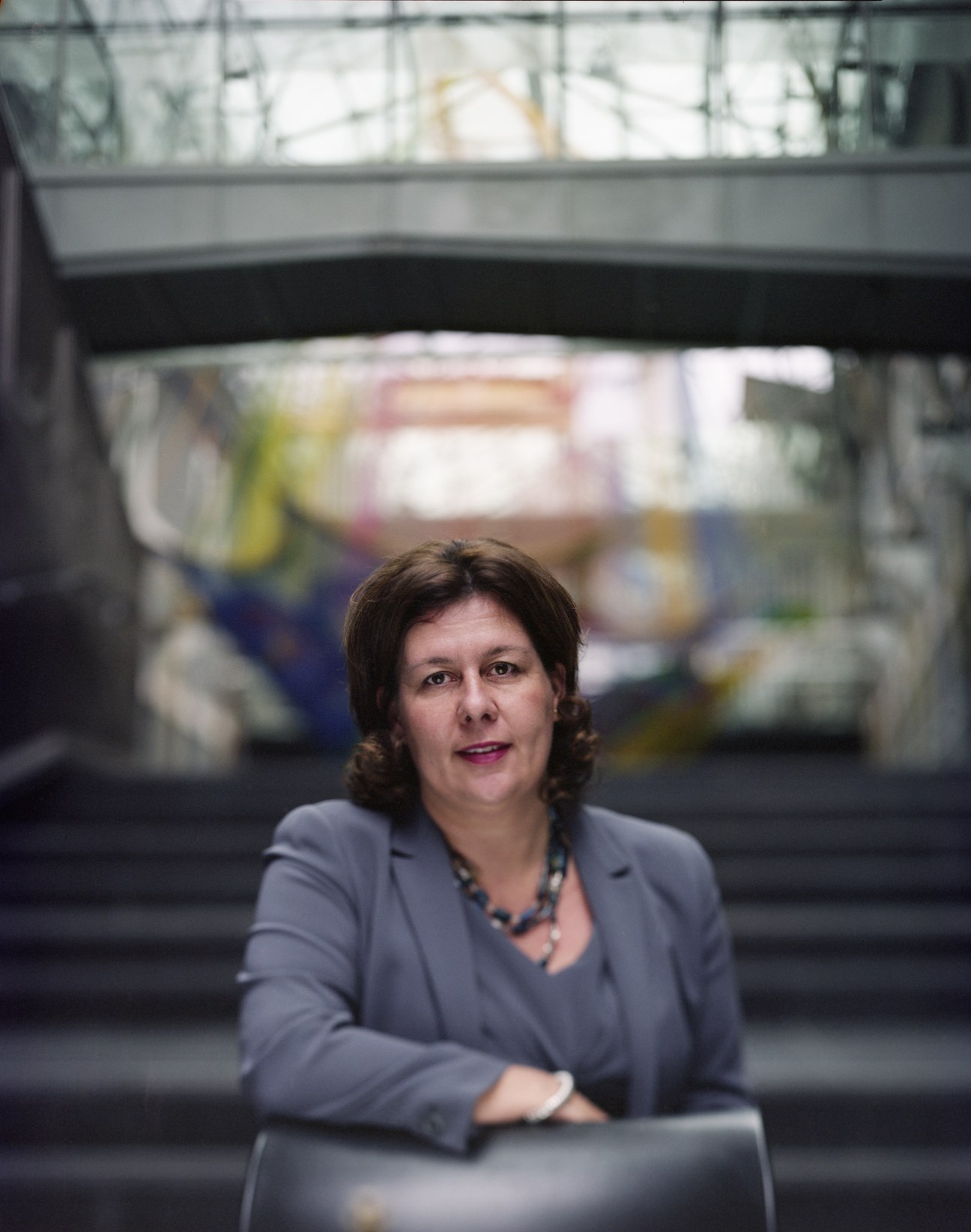 Francesca Gostinelli, head of business development at Enel, poses for a portrait in front of an industrial facility.