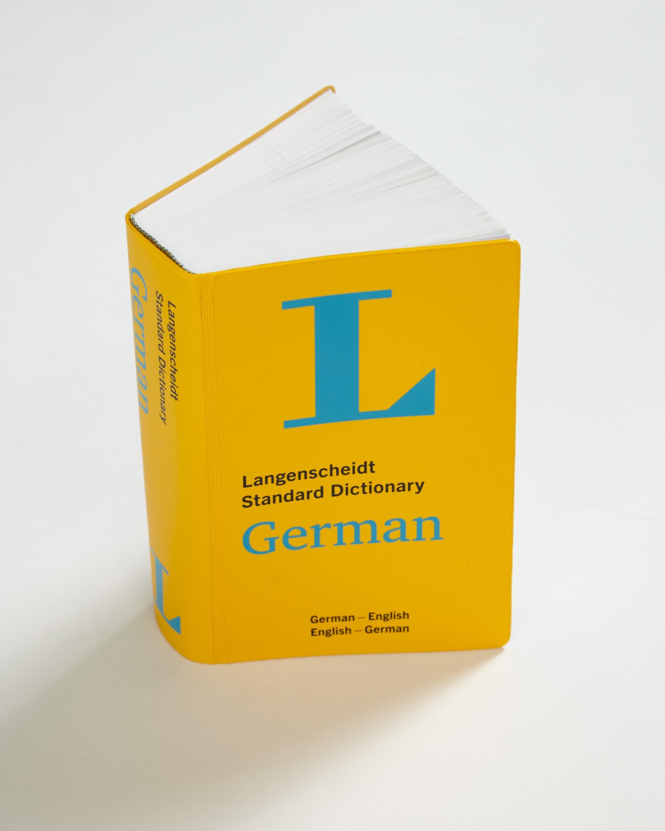 Langenscheidt Standard Dictionary German with yellow cover and blue logo.