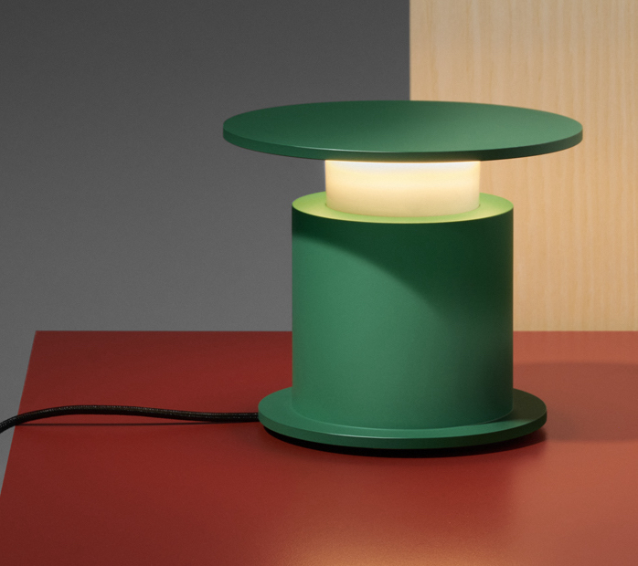 Green W241 Faro lamp on red surface