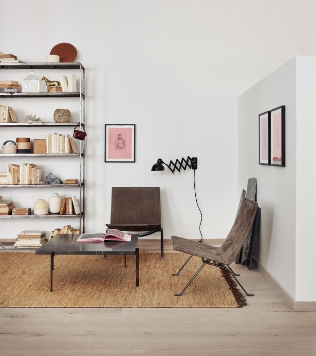 Fritz Hansen flagship store interior with iron pillars, wide oak floorboards and glass partitions