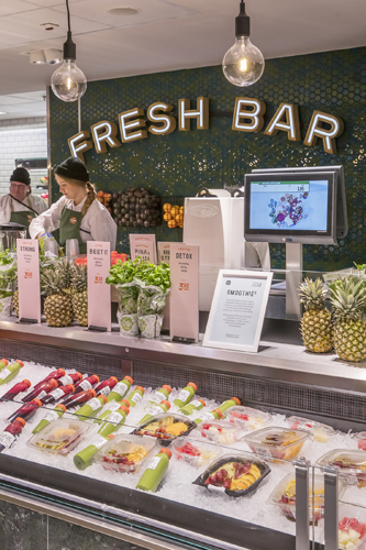 Interior of Stockmann food hall in Helsinki showing fresh produce displays and shoppers