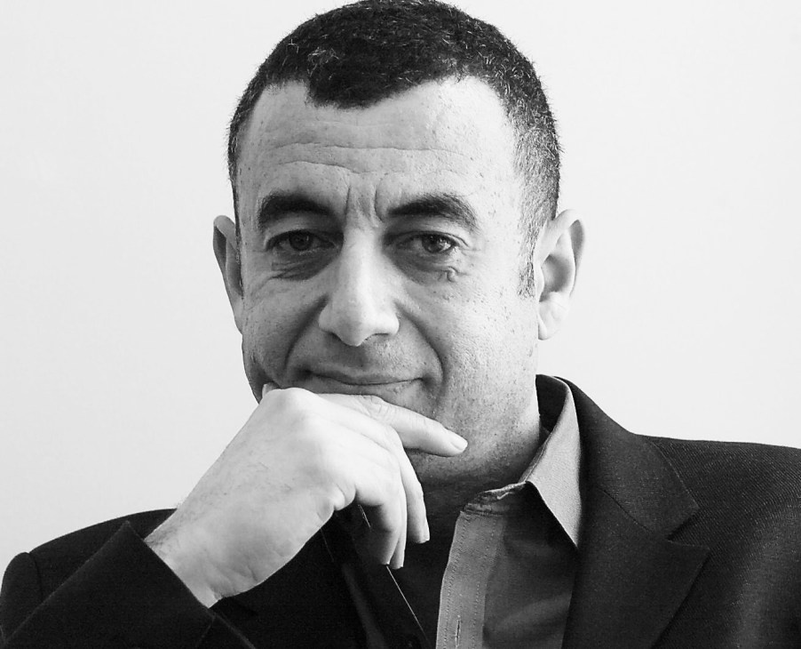 Black and white portrait photograph of Hisham Youssef, President of the UAE Architectural Association.