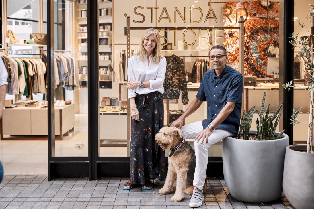 Two people stand outside The Standard Store storefront in Barangaroo retail strip, Sydney.