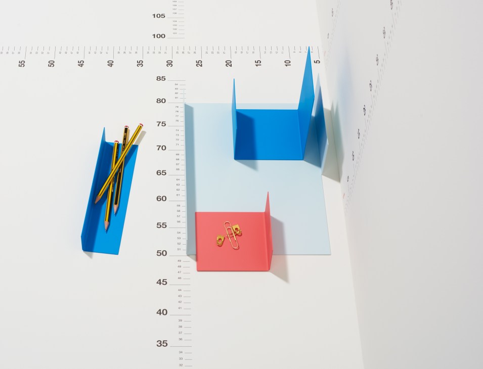 Japanese porcelain tea set for two by Asahiyaki displayed on a measurement ruler.
