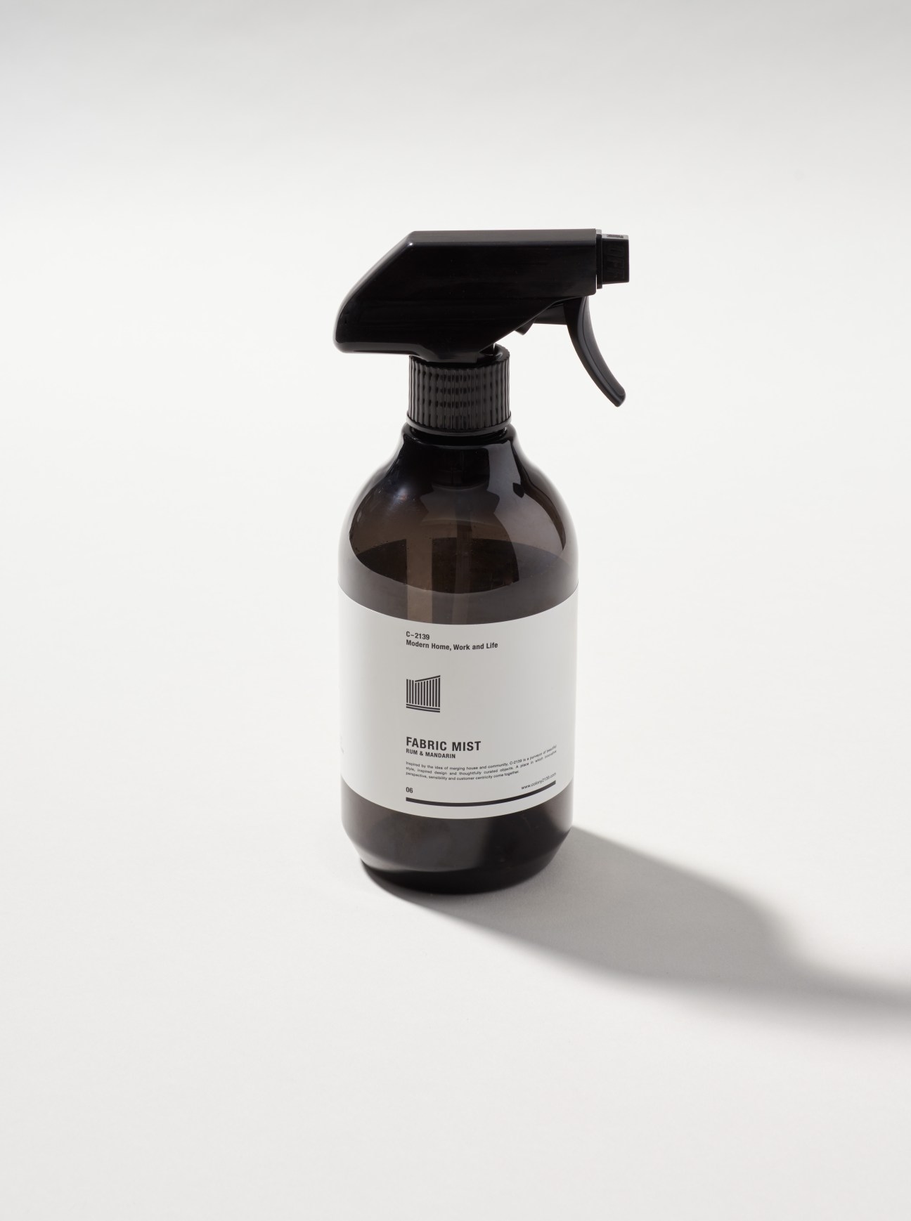 Colony 2139 fabric mist spray bottle with dark glass and black trigger sprayer.