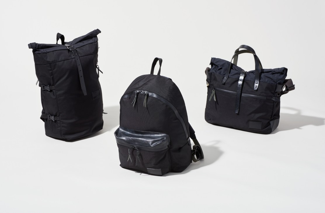 Three black Nanamica bags made from Cordura nylon with leather trim displayed against a white background.