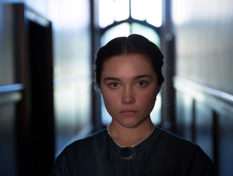 Florence Pugh as a young bride in a dark corridor from the film Lady Macbeth.