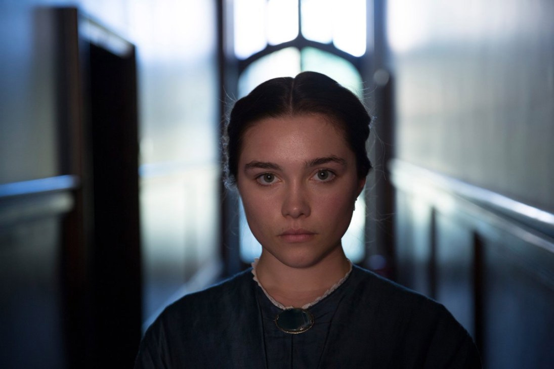 Florence Pugh as a young bride in a dark corridor from the film Lady Macbeth.