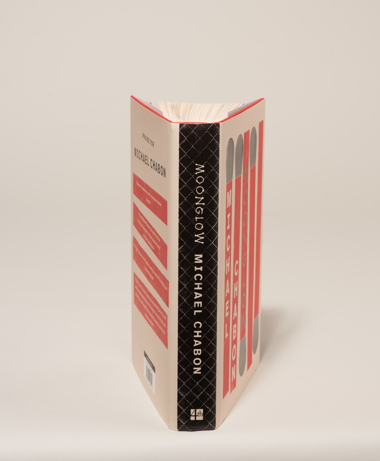 Cover of Moonglow book by Michael Chabon with cream and red geometric design