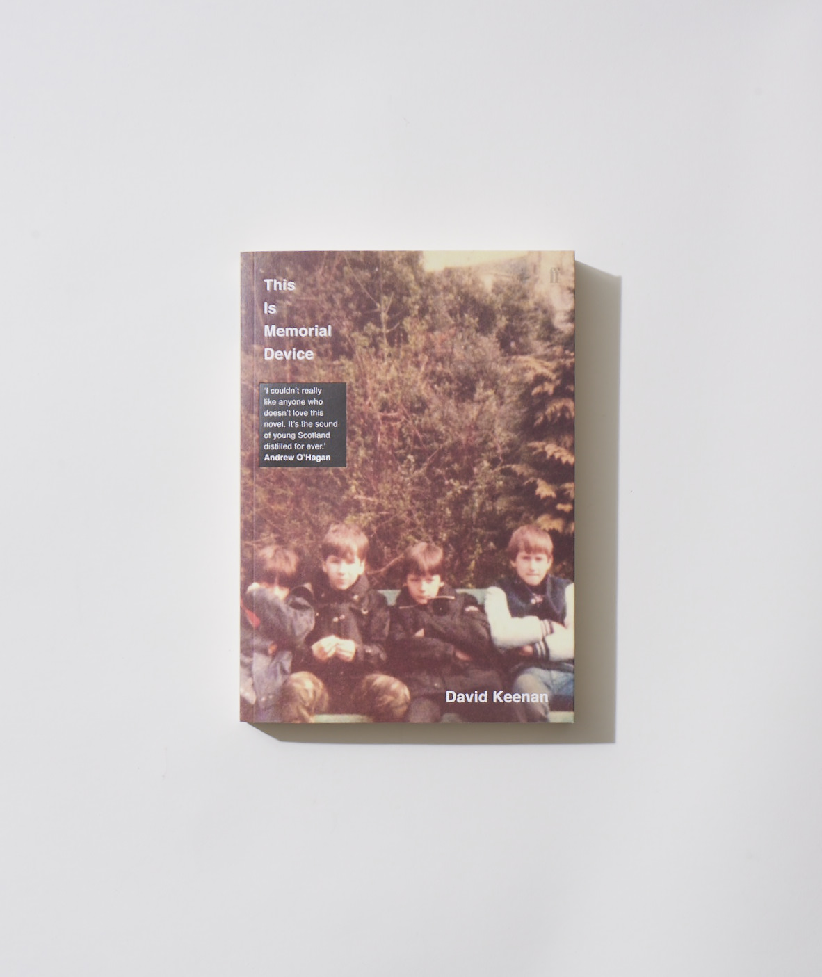 Book cover of This Is Memorial Device by David Keenan featuring children and forest background