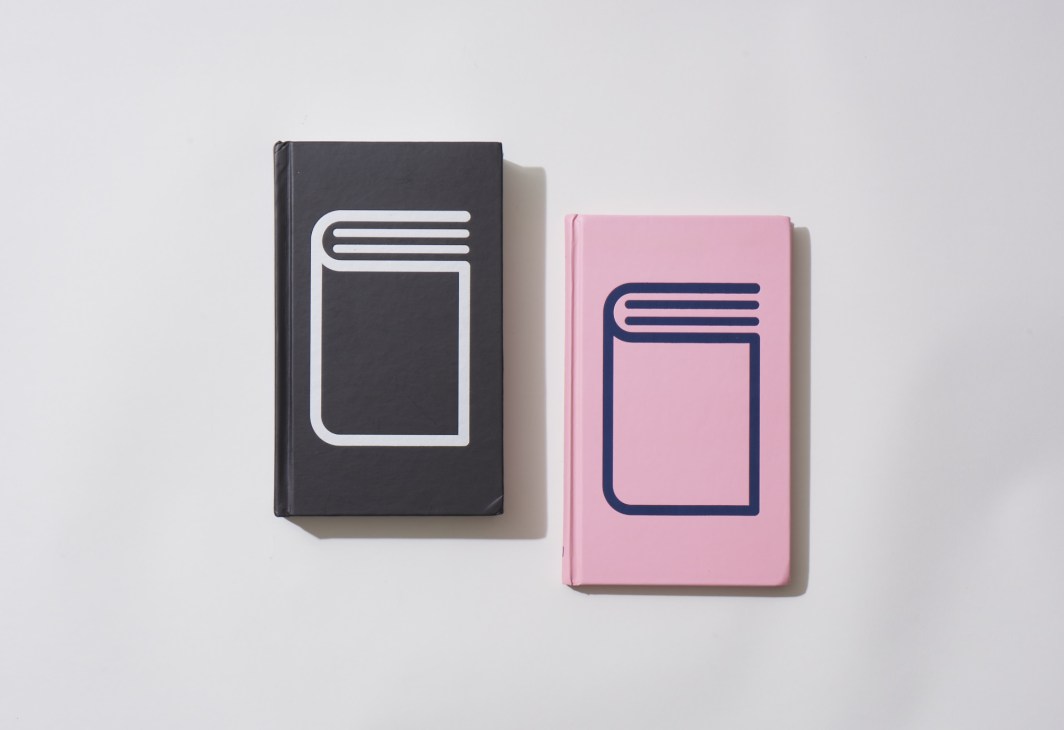 Two design books with book-icon covers, one black and one pink, by Cadson Demak.