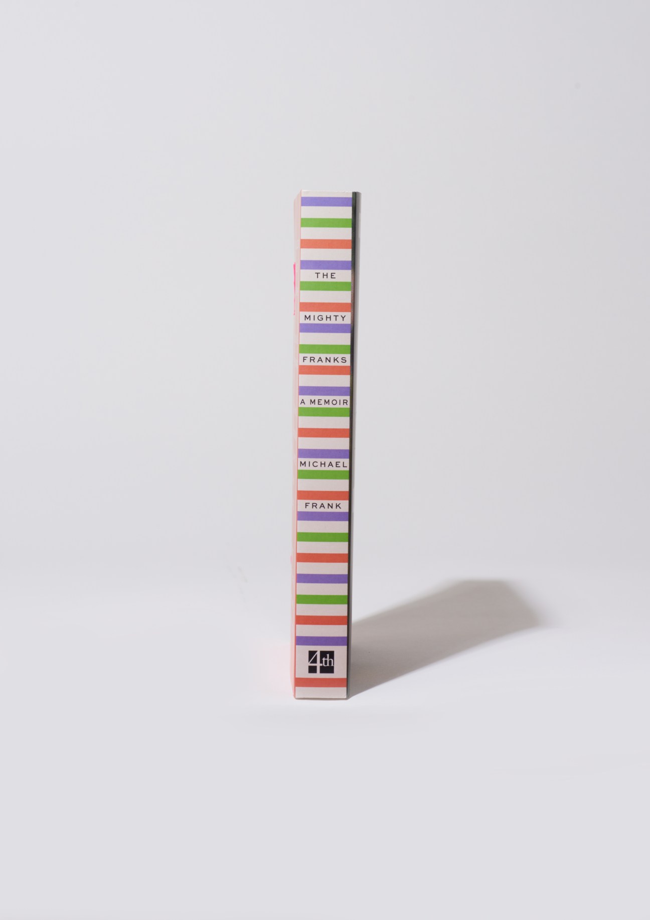 Book spine of The Mighty Franks: A Memoir by Michael Frank with colorful striped design and 4th Estate publisher logo.