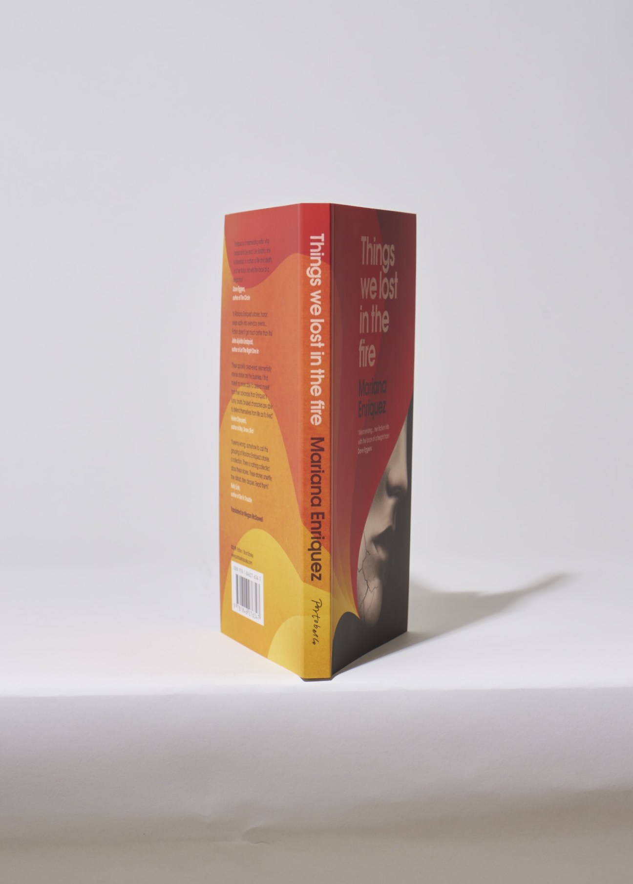 Book cover of Things We Lost in the Fire by Mariana Enriquez with red and yellow gradient design.