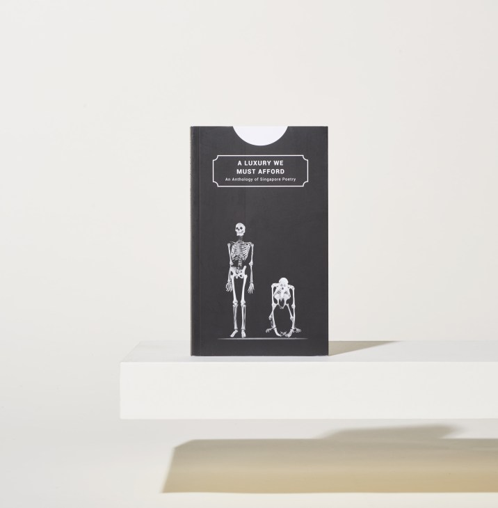 Black book cover featuring two white skeleton illustrations and the title 'A Luxury We Must Afford: An Anthology of Singapore Poetry'