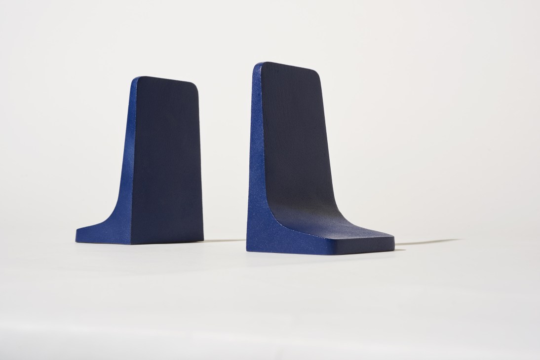 Pair of minimalist cast-iron bookends by Matter Made in dark blue and black.