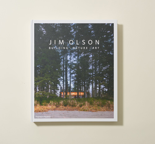 Jim Olson's 'Building, Nature, Art' book cover featuring a modern wooden cabin in a forest clearing.