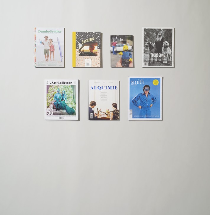 Six Australian magazines displayed on a wall: Dumbo Feather, Lunch Lady, Art Guide, Four&Sons, Art Collector, Alquimie, and Smith Journal.