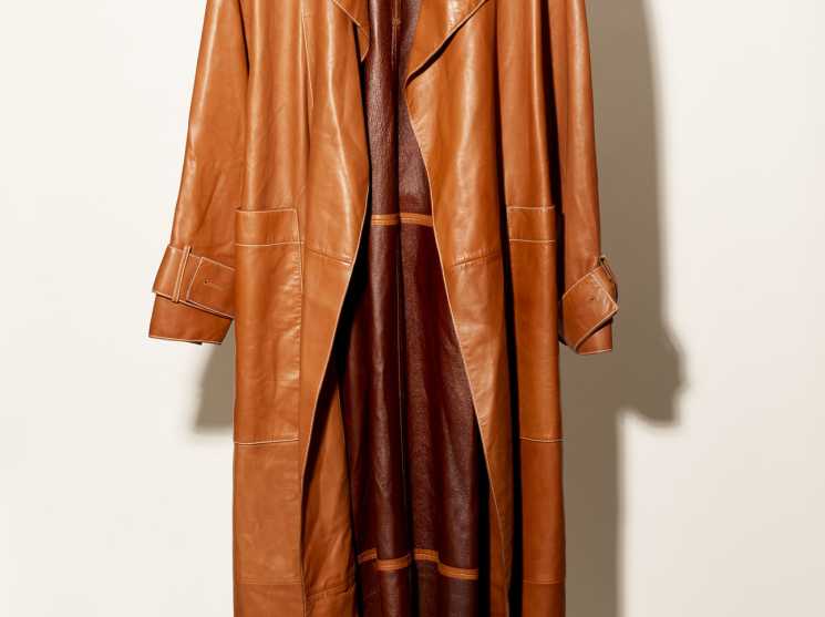 Pringle of Scotland black leather coat displayed on a hanger