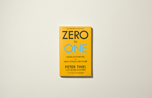 Cover of Zero to One by Peter Thiel and Blake Masters featuring yellow background with blue text.