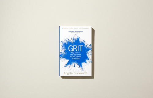 Cover of 'Grit' by Angela Duckworth featuring blue splash design and white text.