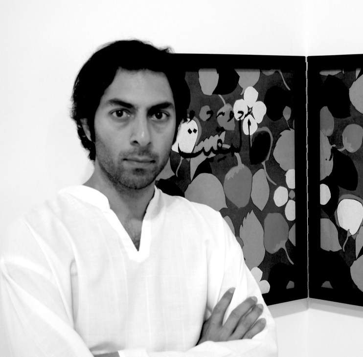 Portrait of artist Shezad Dawood posing with artwork featuring circular botanical motifs in background.