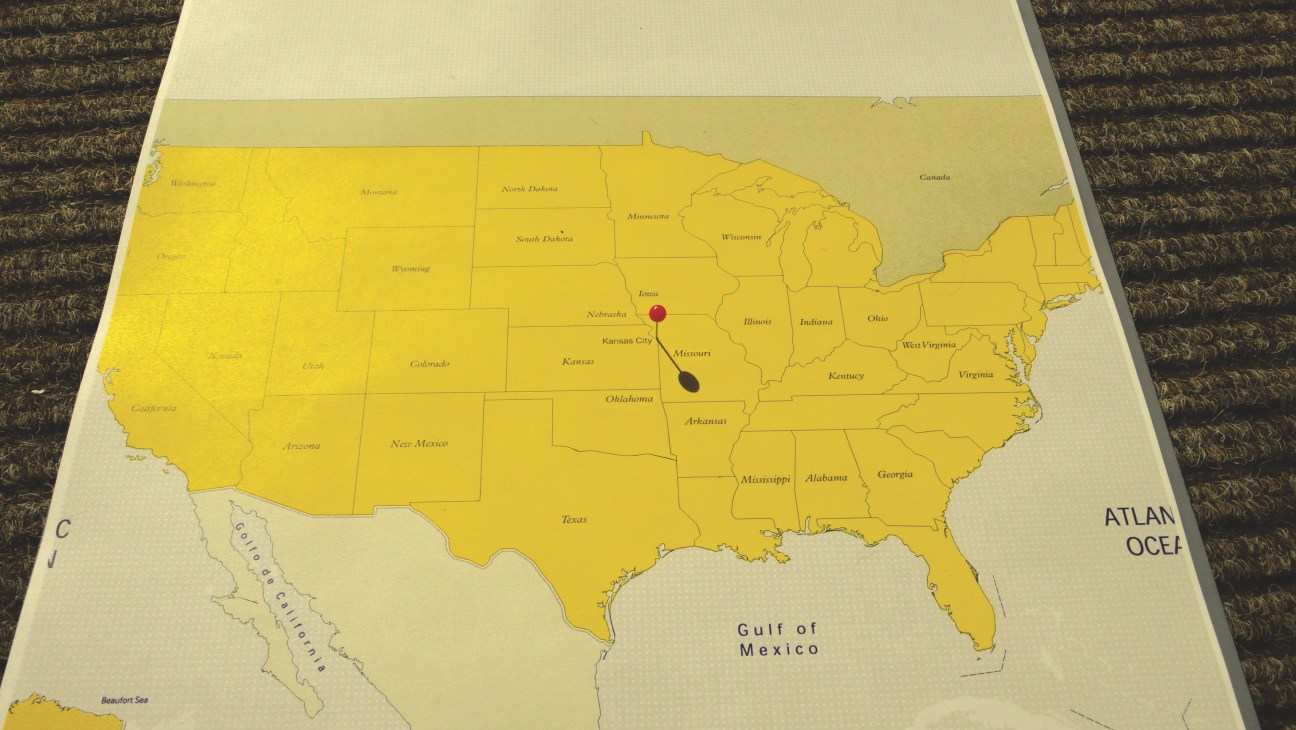 US map with Kansas City marked by a red dot and black teardrop shape indicating its central location.