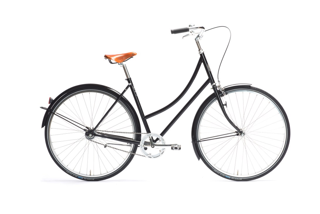 Black Pelago Brooklyn utility bicycle with Brooks leather saddle against white background.